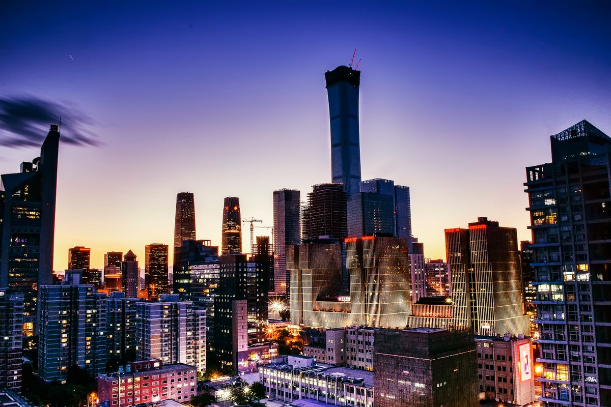 Illuminated skyscrapers of Beijing's modern skyline at dusk, home to the city's main hotel districts