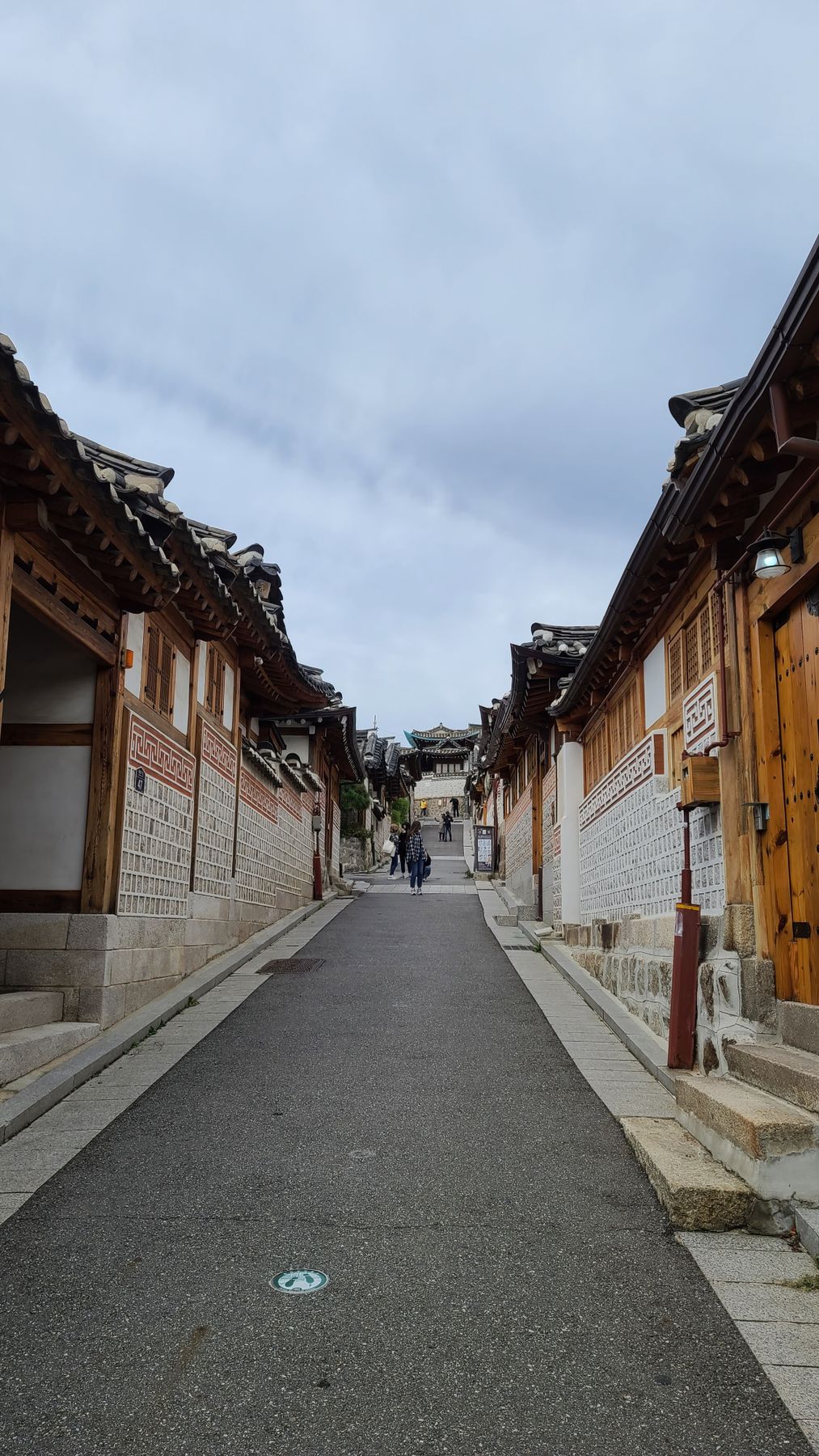 Narrow alley lined with traditional hanok houses in Bukchon Hanok Village, Seoul
