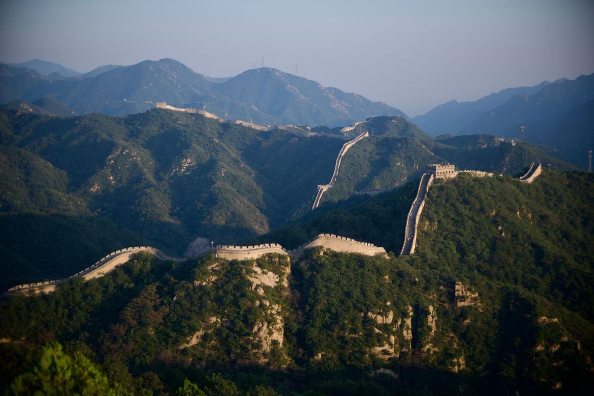 The Great Wall at Mutianyu winding across forested mountains