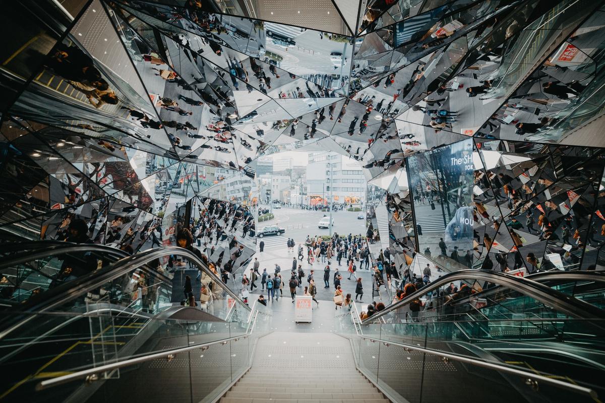 Escalators and modern architecture inside a Tokyo shopping mall