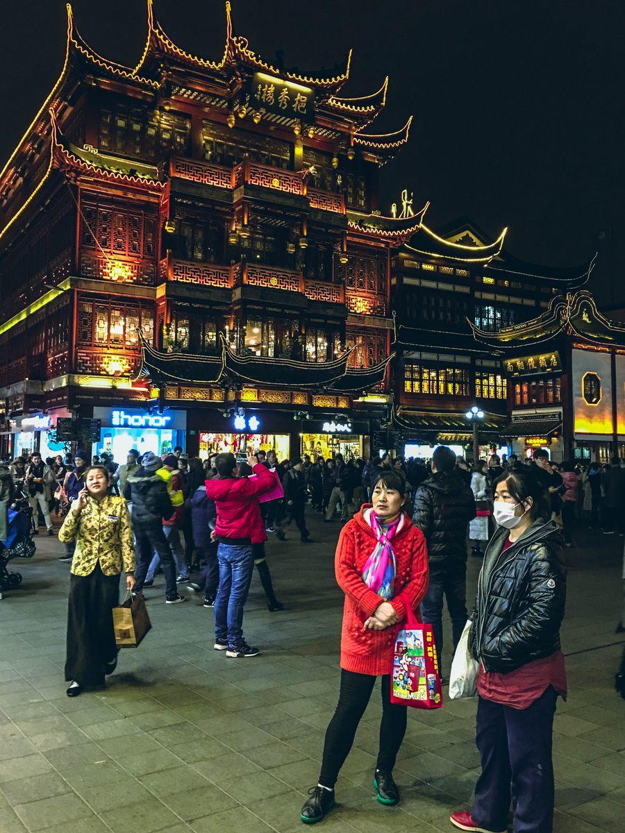 Yuyuan Bazaar at night, old Shanghai shopping street with traditional architecture outside Yu Garden