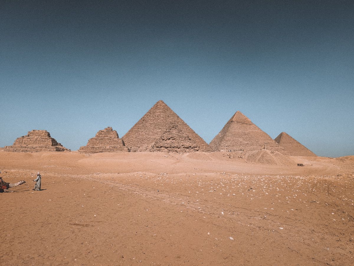 The Great Pyramid of Khufu and the smaller pyramids of the Giza plateau at sunrise, Cairo, Egypt